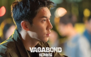 Pegang Pistol, Wajah Lee Seung Gi Penuh Luka di Foto Perdana 'Vagabond'