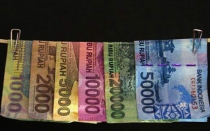 Viral Prajurit TNI Cuci Uang Jutaan Rupiah Pasca Banjir Bandang Sentani, Faktanya Bikin Haru