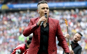 Robbie Williams Yakin Terinfeksi Virus Corona