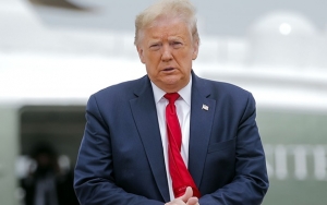 Trump Ancam Berhenti Tonton Sepak Bola AS Jika Atlet Masih Berlutut Saat Nyanyikan Lagu Nasional