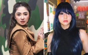 Visual Dewi Perssik saat Tolak Dipayungi Sekuriti Dipuji Mirip Yunjin LE SSERAFIM
