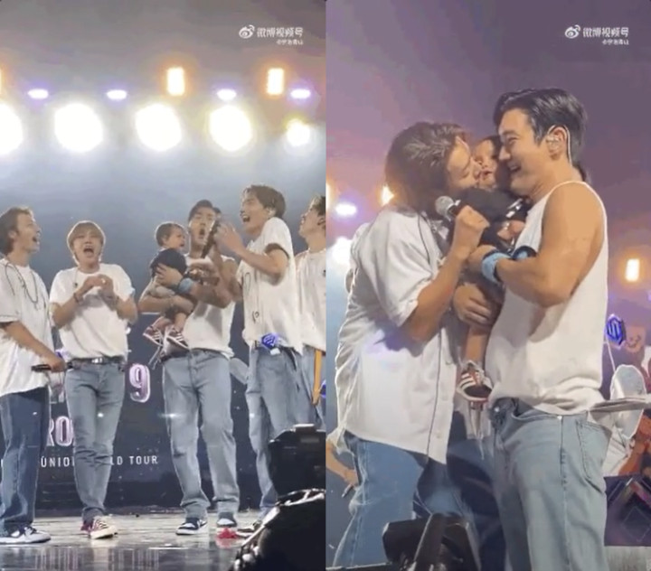 Super Junior main dengan bayi di konser