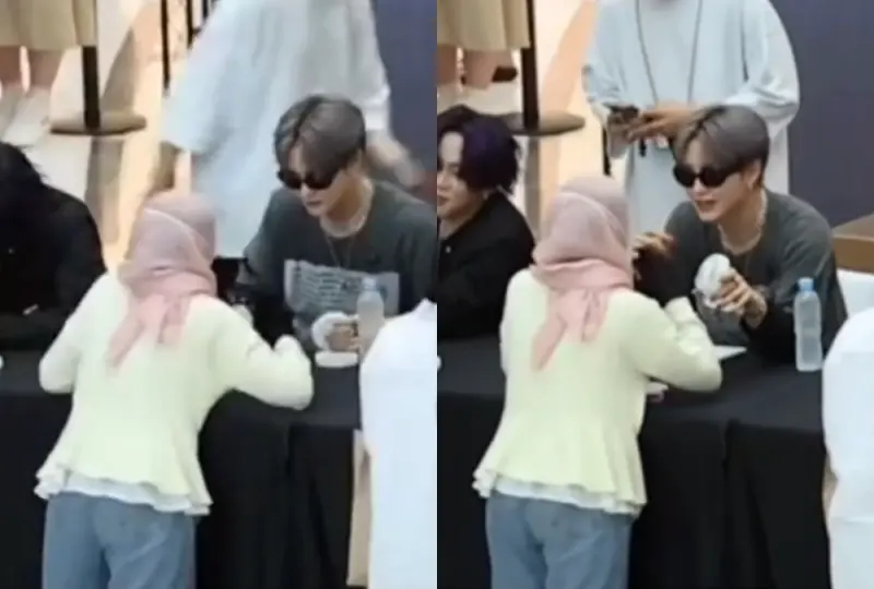 Jihoon TREASURE memberikan kipas ke fans