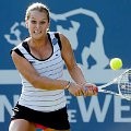 Dominika Cibulkova (Slovakia) berusaha mengembalikan bola dari Marina Erakovic (New Zealand)