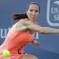 Jelena Jankovic berusaha mengembalikan bola dari Maria Sharapova