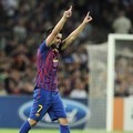 David Villa merayakan kemenangan setelah membobol gawang AC Milan
