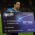 Xavi Hernandez Holds UEFA Charity Cheque