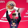 Kimi Raikkonen, Sebastian Vettel dan Romain Grosjean di Podium Kemenangan