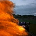 Mobil Mark Webber Terbakar dari Arah Belakang