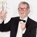 Chris Moore Raih Piala Special Recognition