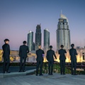 EXO tampak sibuk merekam pertunjukan air mancur dengan ponsel masing-masing.