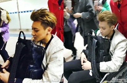 Fans Khawatir Lihat Tao EXO Mudik Imlek Pakai Kursi Roda