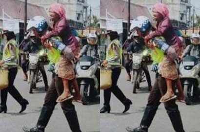 Bikin Bangga, Beredar Foto Polisi Gendong Nenek Saat Nyeberang