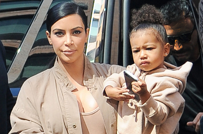 Tak Melulu Pamer Lekuk Tubuh, Kim K Unggah Pose Unyu Bareng North West